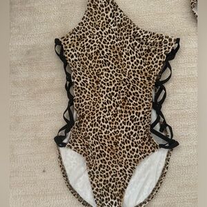 Norma kamali leopard print with side X’s